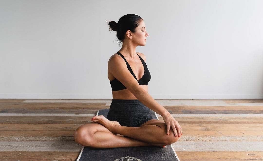 woman stretching on a yoga mat