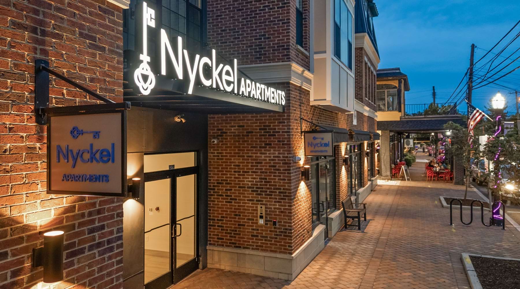 the entrance to a building with a sign above the door