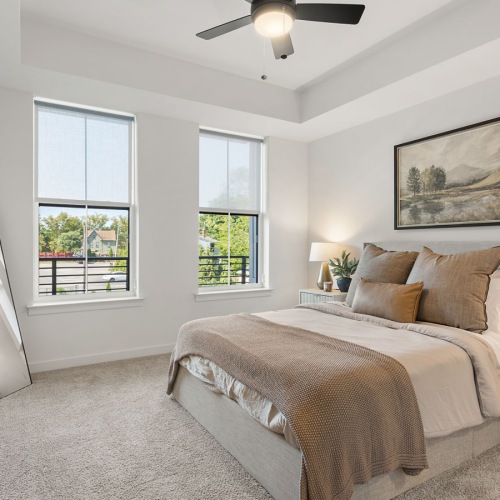 Bedroom with natural lighting and high ceilings