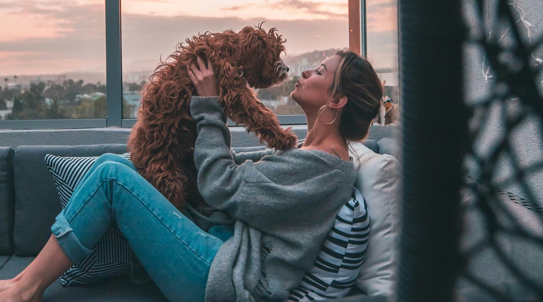 a woman holding a dog