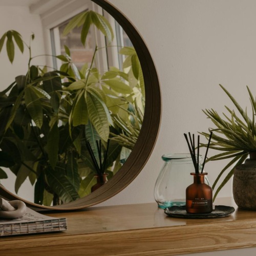 a mirror is above a table